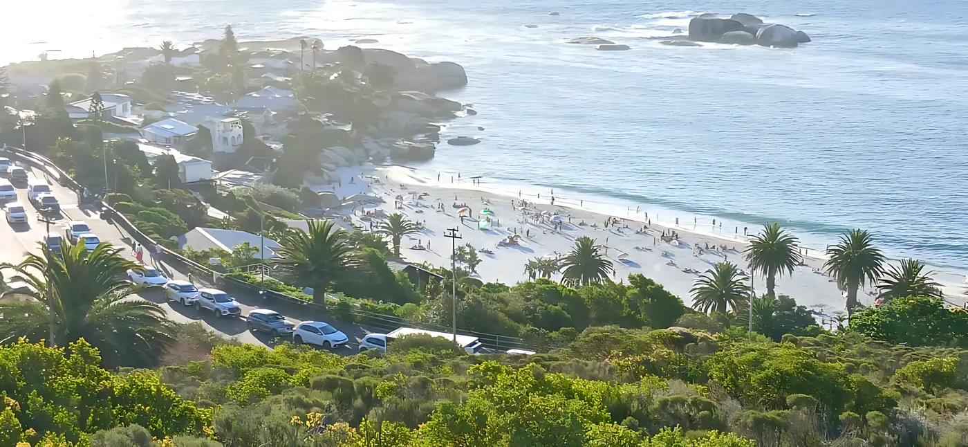 Busy white-sand beach below Victoria Road